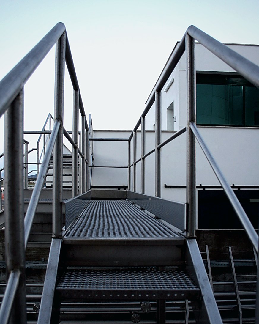 Tank access ladder and terminal height